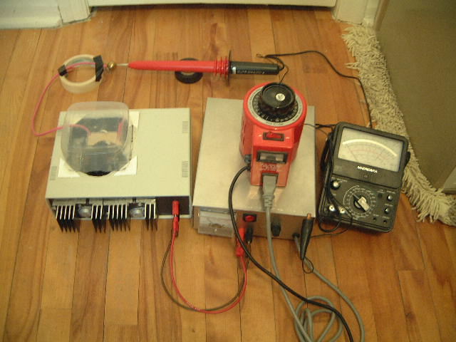 Measuring the output of the DIY/homemade 30kV high voltage power supply using a Fluke 80k-40 40kV high voltage probe hooked up to an analog meter.