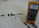 Measuring the capacitance of a
        barium titanate and epoxy cylindrical capacitor.
