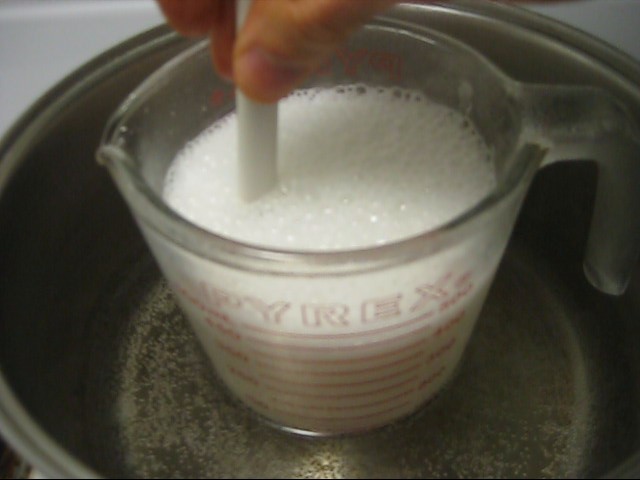 Step 4 in making rochelle salt piezoelectric crystal, the solution bubbling up.