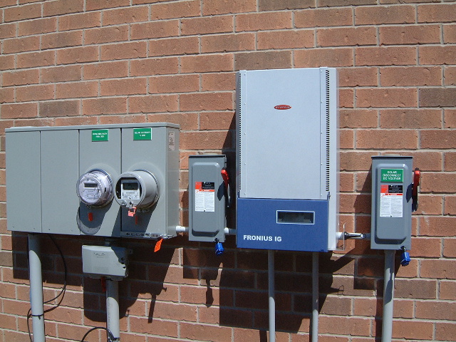 An Ontario microfit system showing the inverter, disconnect box and meters.
