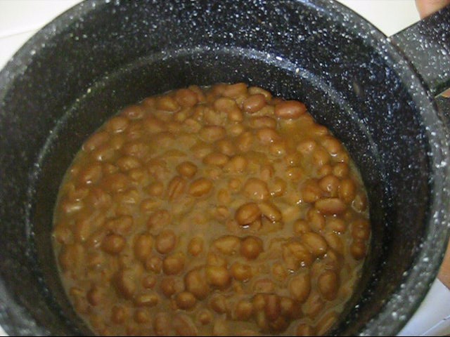 Canned beans cooked using a car sunshade solar cooker.