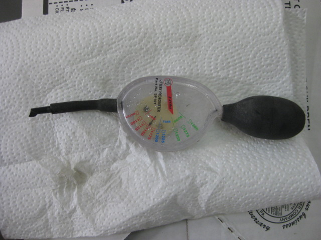 A dial type hydrometer for measuring specific gravity in solar batteries.