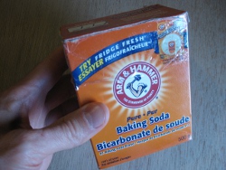 Baking soda from a grocery store for cleaning acid off the top of solar batteries.