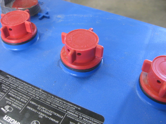 Normal cell cap for a flooded lead acid battery - top view.