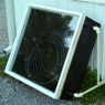 Solar hot water heater using a flat spiral coil made of PEX.