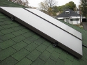 Enerworks solar water heater panel on a roof.