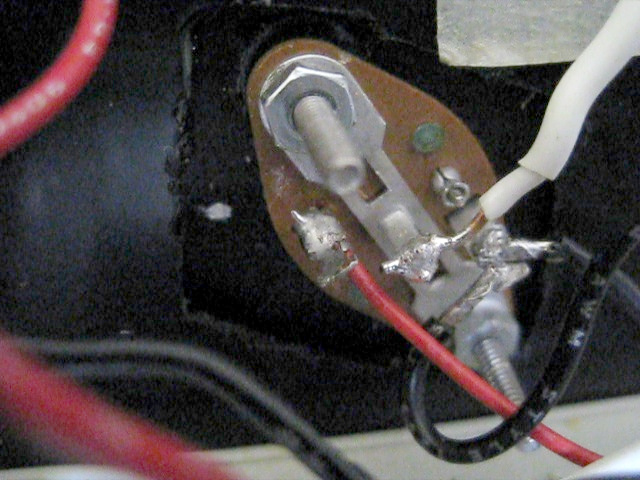 Side of transistor mounted to heat sink using mounting kit and showing the wiring.