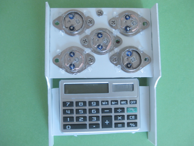 Calculator powered by solar panel made of solar cells made from 2N3055 power transistors.
