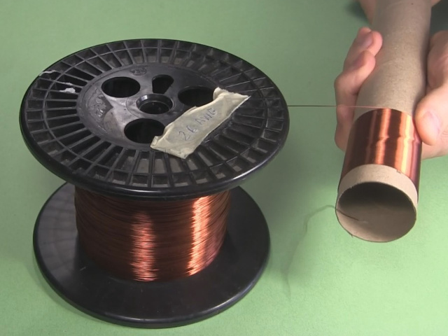 Winding a coil by hand.
