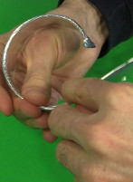 Bending the foil covered wire into a cylinder.