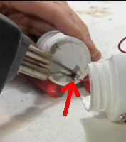 ... and then soldering the other end of the red coil to the other two CFL wires.