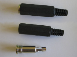 Stereo audio jack sockets (female) with one showing internals.
