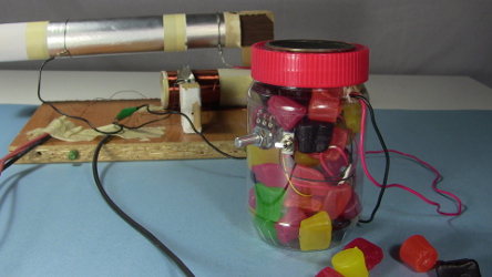 My homemade crystal radio amplifier in a jar filled with Jujubes.