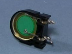 The exposed piezoelectric crystal from the microwave oven's piezo speaker.