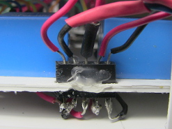 Female pin header on circuit board.