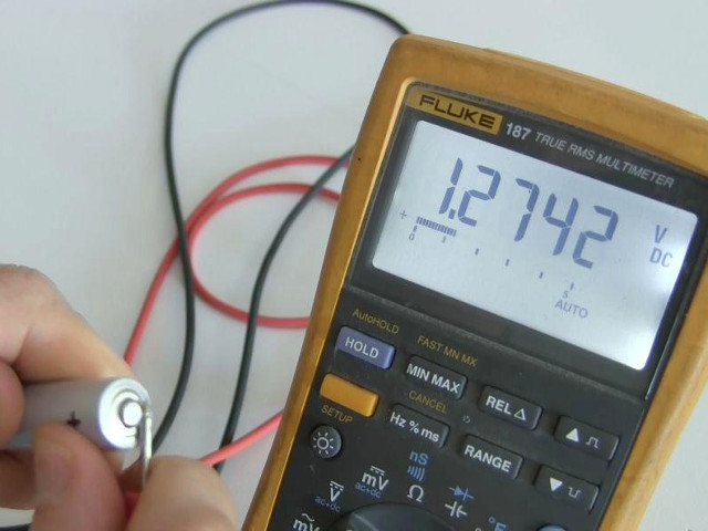 Measuring the battery voltage with a digital multimeter (DMM) and getting 1.27, not enough to run the LED.