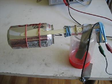 Homemade/DIY Van de Graaff generator with a Coke soda can for the dome and only the wire from the brush going inside the can.