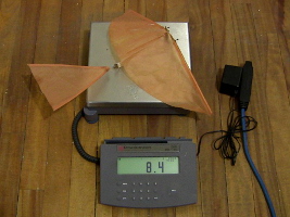 Weighing a rubber band ornithopter.