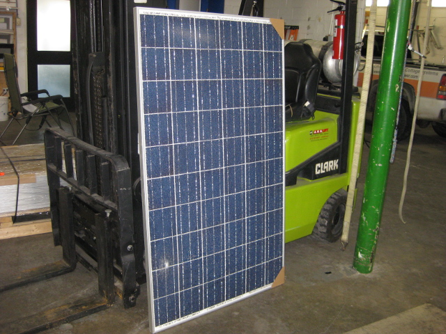 Solar panel damaged by a falling tree, shattering the tempered glass.