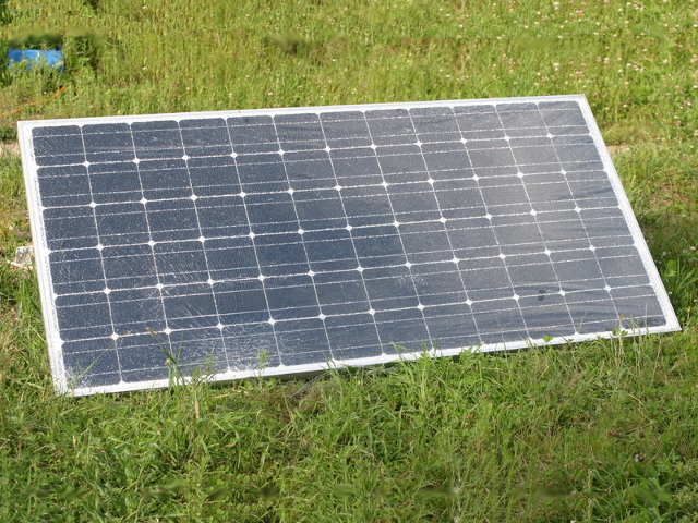 Solar panel with glass shattered on bottom left only.