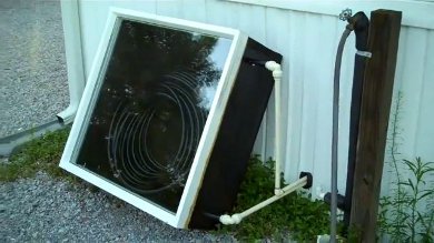 The finished solar thermal collector, including piping into the crawl space.