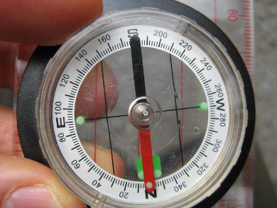 Finding magnetic north and magnetic south using a compass.