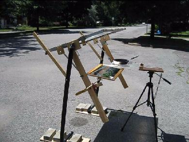 The complete fresnel lens and mirror solar cooking setup.