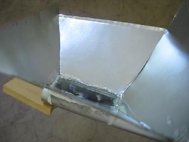 The reflector. The fresnel lens has a well defined focal point but it's not perfect.