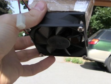 PC fan attached to the mini screen solar air heater's cold air inlet.