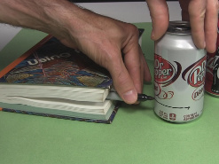 Drawing a line around the cans near the bottom for the alcohol
      stove.