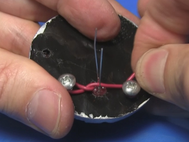 Using wire to hold the LED in place in the back of BB-8's radar eye.