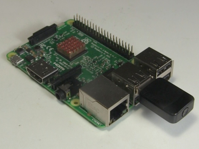 A WiFi dongle plugged into the Raspberry Pi.