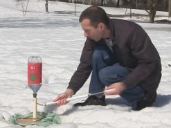 Pumping air into the bottle rocket.