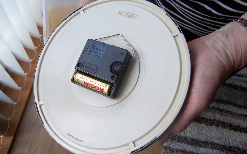 Joule thief powering clock showing the rear of the clock.