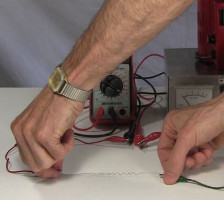 Stretching the nitinol wire/shape memory alloy coil to test it.