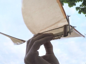 The ornithopter's rubber band and cranking mechanism with the wings up.