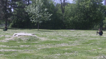 Photophone in a park with the receiver on the left and 
      far away on transmitter on the right.