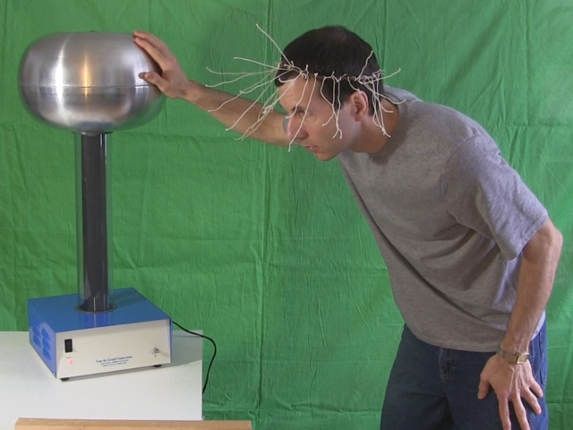 Big Van de Graaff generator doing the 'hair raising' demo.