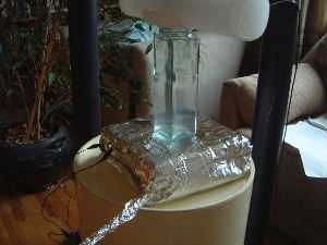 A closer view of the digital scale covered in aluminum foil
acting as a Faraday cage.