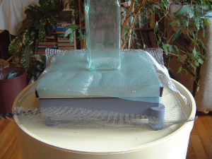 The digital scale with grounded fine wire mesh acting as a
Faraday cage.